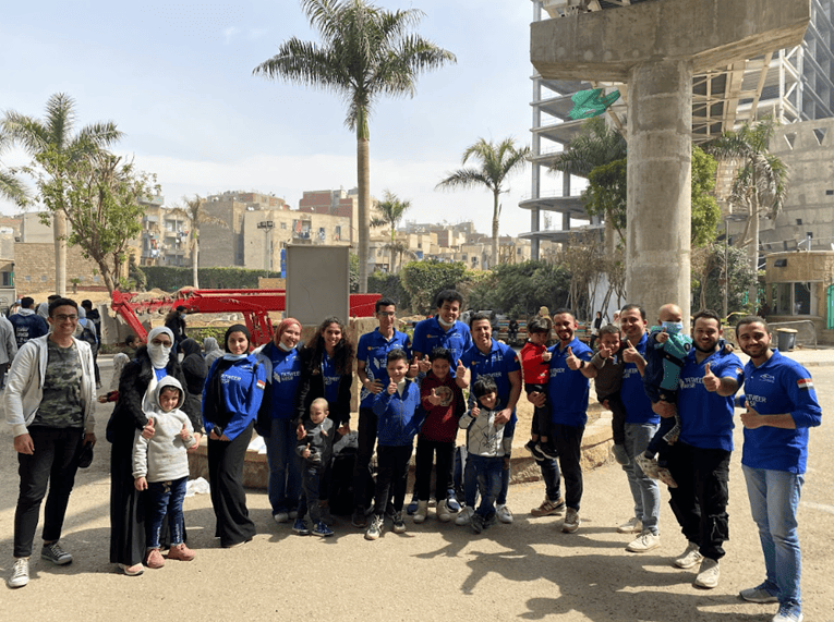 Eco Racing Team posing for a photo with the children Members of the Eco Racing Team posing for a photo with the children of 57357 Hospital during a heartwarming visit.